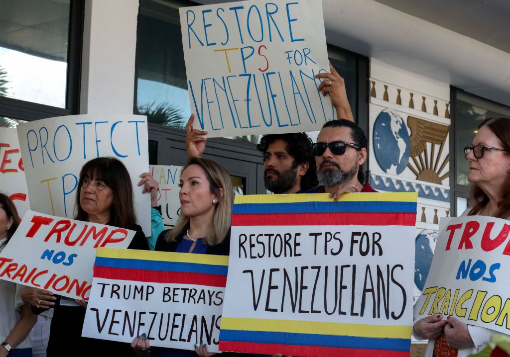 Laura Kelley, Miami-Dade County Democratic Party chair, (second from the left) joins others to support a resolution in favor of reinstating temporary protected status for Venezuelans in February in Miami.